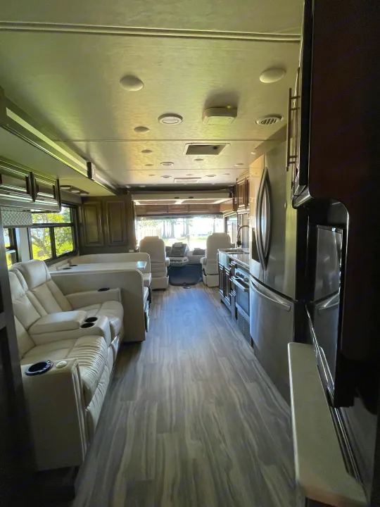 Modern RV rental interior with kitchen, recliners, and cockpit. Ready for your road trip adventure.. Georgetown GT7 2022
