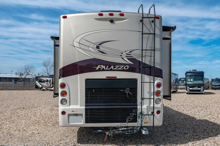 This cream and purple Palazzo motorhome, seen from the rear with a ladder, could be your next rv rental.. Thor Palazzo 2013