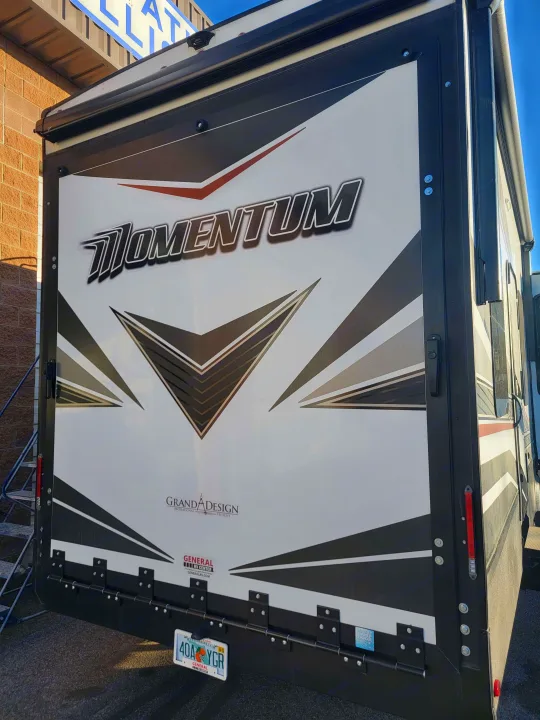 This Grand Design Momentum toy hauler, with its large rear ramp door, is ideal for an rv rental.. Grand Design Momentum 2022