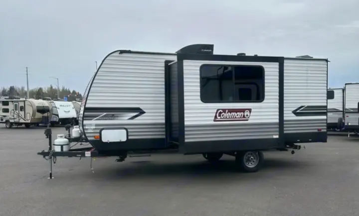 This Coleman travel trailer, with an extended slide-out and propane tanks, is ready for RV rental and camping adventures.. Dutchmen Coleman Lantern Lt 19BB 2024