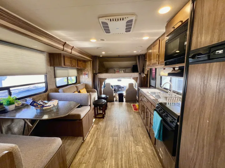 Step inside this cozy RV rental, featuring a full kitchen, comfortable dinette, and a spacious living area.. Jayco Envoy 100 2018