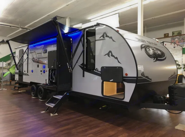 Spacious travel trailer, ideal for your next RV rental adventure. Features a large awning with cool blue LED lights.. Forest River Cherokee Grey Wolf Black Label 2021