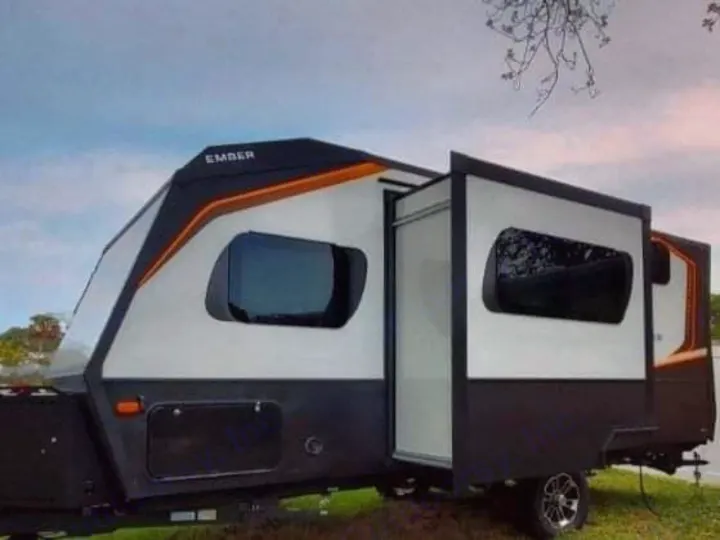 This modern Ember travel trailer is a fantastic RV rental choice, featuring a black, white & orange exterior.. Ember 191MBD 2022