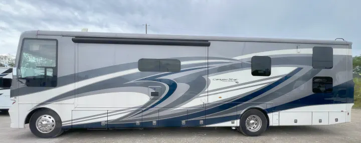 Explore in style! This sleek grey & white Canyon Star RV, with its unique graphic design, is ready for your rv rental.. Newmar Canyon Star 2021