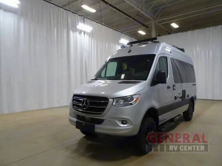 Silver Mercedes-Benz Sprinter van, a modern RV rental option shown at a General RV Center.. Thor Sanctuary 2024