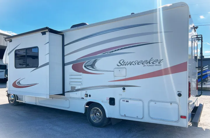 Spacious white Sunseeker RV rental with an extended slide-out for comfortable travel.. Forest River Sunseeker 2016