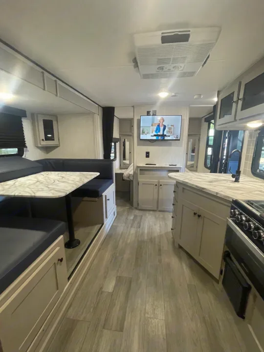Step inside this modern RV rental! Features a comfy dinette, full kitchen, and living space. Perfect for your travels.. Coachmen Apex 245 BHS 2025