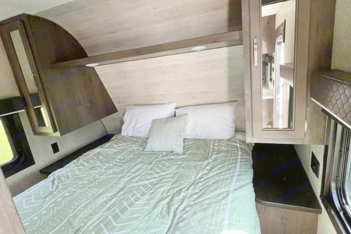 Cozy RV rental bedroom with a comfy bed, overhead storage, and a window. Perfect for your travel adventures!. Jayco Jay Flight 2022
