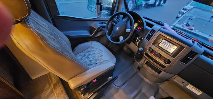 Spacious RV rental cockpit features quilted leather seats, a Mercedes steering wheel, and multimedia display.. Wayfarer Wayfarer Motorhome 2018