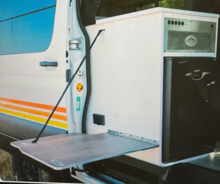 RV rental: Camper van with an integrated mobile kitchen, featuring a fold-down table, grill, and fridge.. Storyteller Overland Storyteller Overland Class B 2023