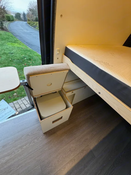 Explore this RV rental's clever interior: organic cotton bed, adjustable table, and hidden pull-out toilet.. Dave & Matt Vans Dave & Matt Vans Class B 2024
