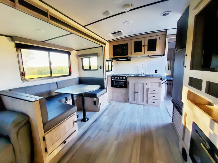 This RV rental offers a bright, modern interior with a well-appointed kitchen and spacious U-shaped dining booth.. Coachmen Northern Spirit 2024