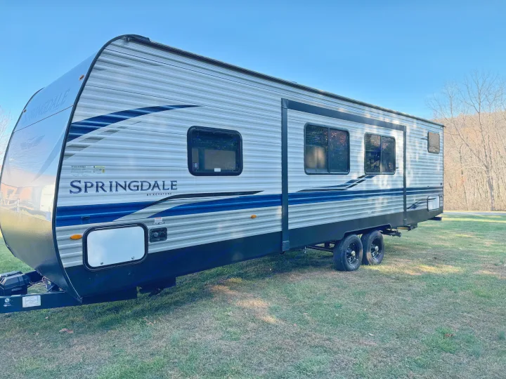 This Springdale by Keystone RV rental, a stylish travel trailer, is ready for adventure on a sunny day.. Keystone RV Springdale 2021