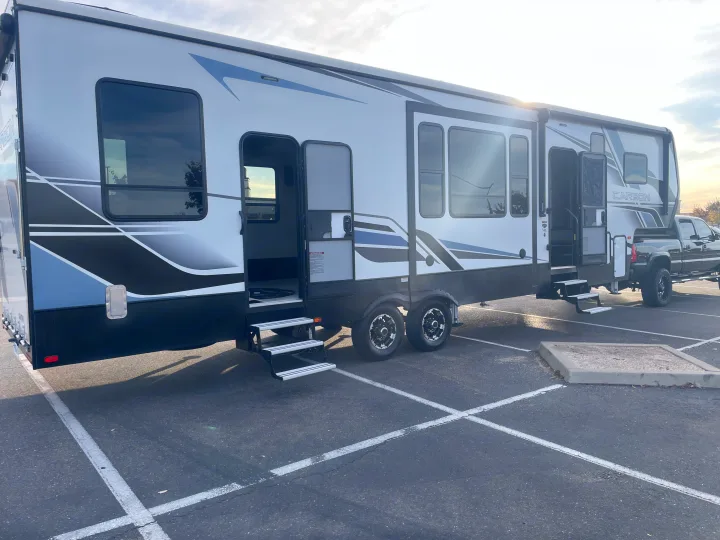This RV rental, a stylish toy hauler fifth wheel, is ready for adventure with its truck. Perfect for travel.. Keystone Carbon 2021
