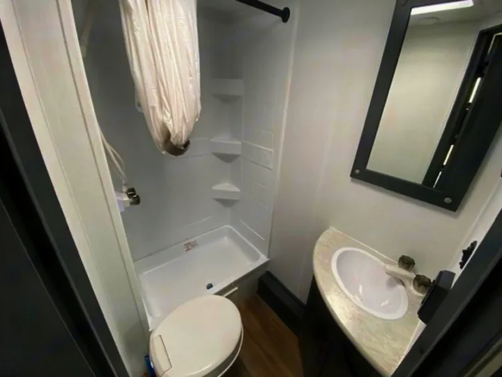 This RV rental features a full bathroom with shower, toilet, sink, and mirror for your comfort.. Keystone Bullet 2024