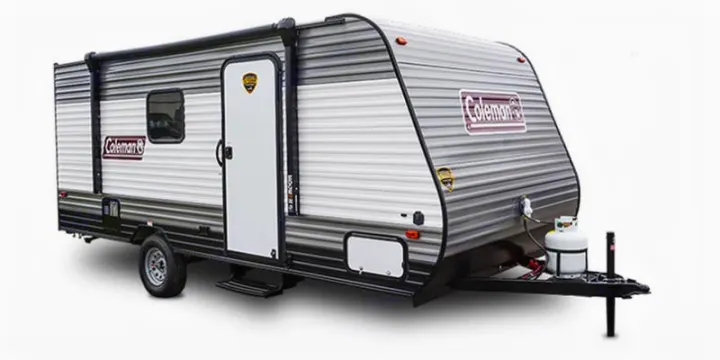 Gray and white Coleman travel trailer, a great option for your next rv rental. Features an awning and propane tanks.. Coleman Lantern 2023