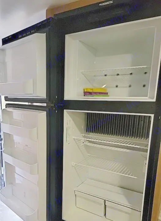 Open, clean Dometic RV refrigerator & freezer with shelves & drawers, ready for your rv rental adventure.. Winnebego Minnie Winnie 2020
