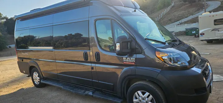Gray Ram ProMaster Tellaro RV rental van shown on a sunny day. Ideal for your next camper van adventure!. Thor Tellaro 2022