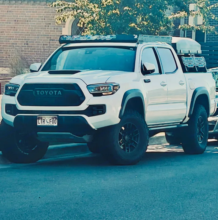 White Toyota Tacoma truck equipped for overlanding & adventure. An alternative to an RV rental for outdoor explorers.. Toyota Tacoma TRD-Pro 2020