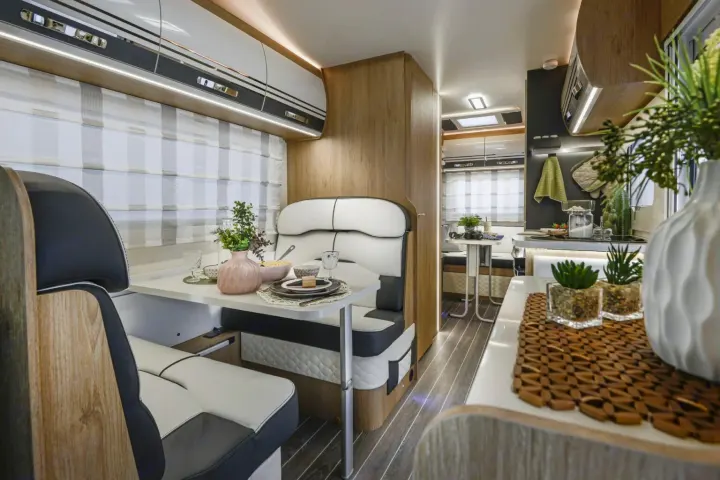 Modern RV rental interior with a cozy dinette, well-appointed kitchen, and comfortable living space.. Roller Team Auto-Roller 746 2025