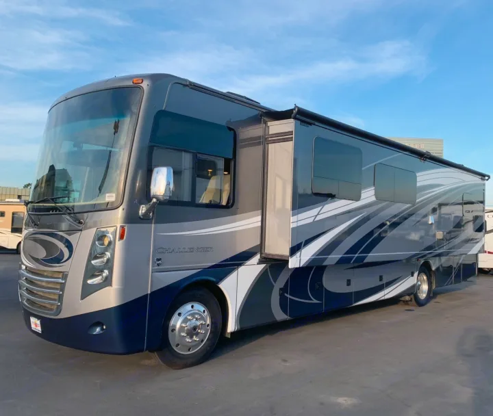 This sleek grey RV rental, a Challenger motorhome, features a modern design, extended slide-out, and spacious interior.. Thor Challenger 2017