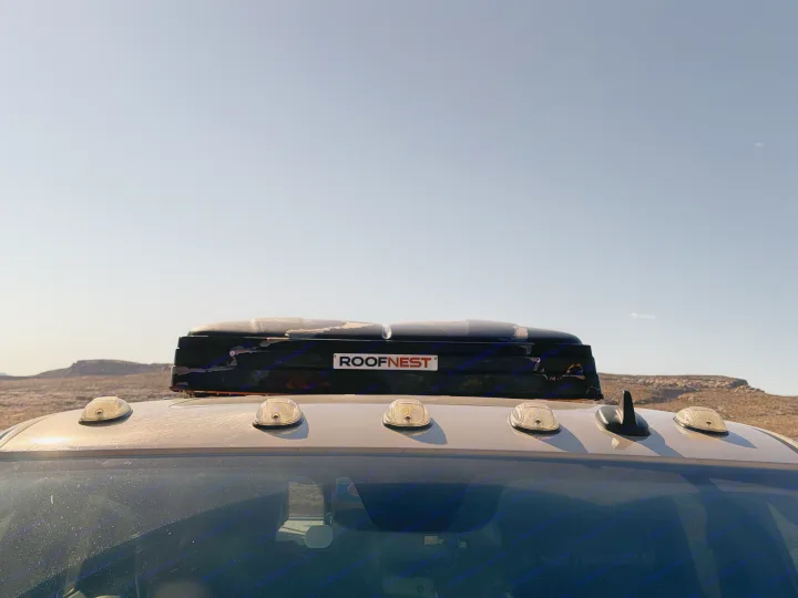 This RV rental with a ROOFNEST rooftop tent is ready for desert adventures under a clear sky.. Dodge Dodge 1 Ton Pu 2018