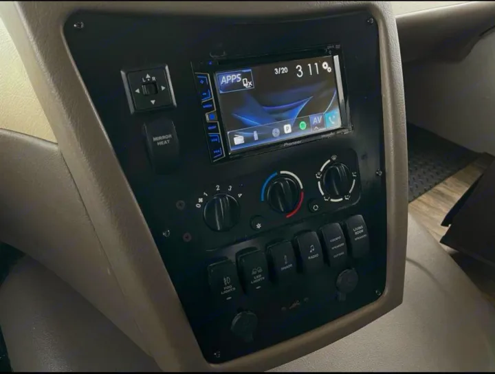 RV rental cockpit controls: dashboard view with stereo, climate, mirror heat, and various light/speaker switches.. FR3 FR3 Motorhome 2017