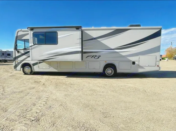 Spacious grey FR3 RV rental parked outdoors with slide-out extended, ready for your next adventure.. FR3 FR3 Motorhome 2017