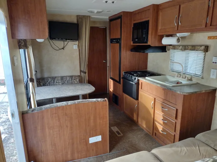 RV rental with a functional kitchen, comfy dinette, and TV for travel.. Jayco Jay Flight Swift 2011
