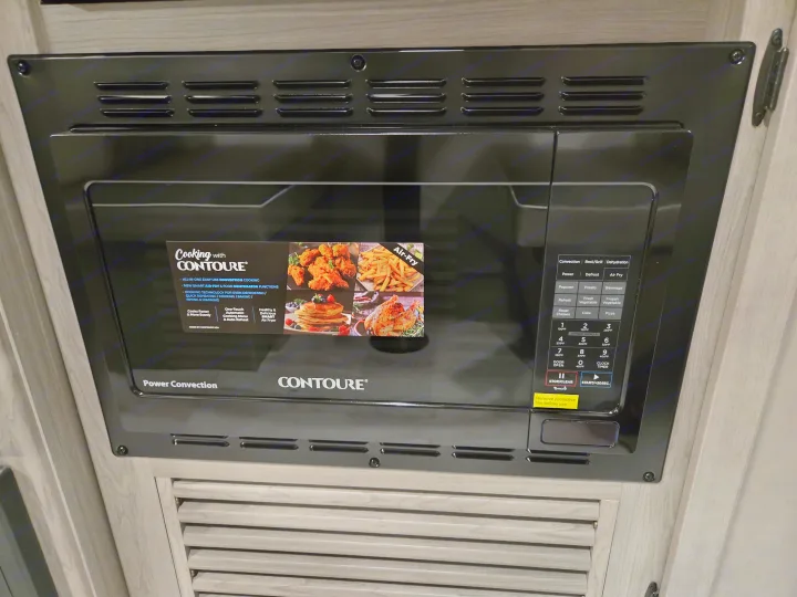 RV rental Contoure microwave convection oven with air fryer for versatile cooking.. Keystone Hideout 240BH 2025