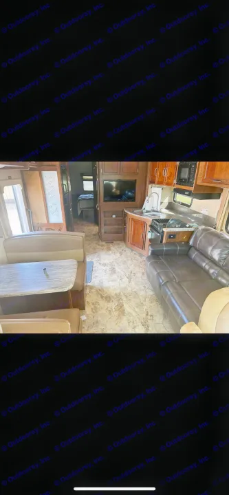 RV rental interior showing a kitchen, dinette, living area with couch, and a peek into the bedroom. Perfect for your next trip.. Forest River Coachmen Pursuit 2017