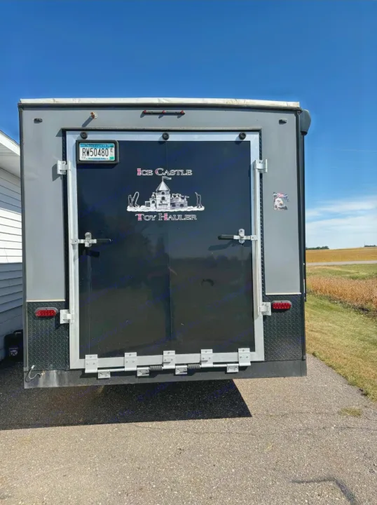 Rear of a Minnesota Ice Castle Toy Hauler recreational trailer. This enclosed trailer is perfect for your next rv rental adventure.. Ice Castle Fish Houses Toy Hauler 2019