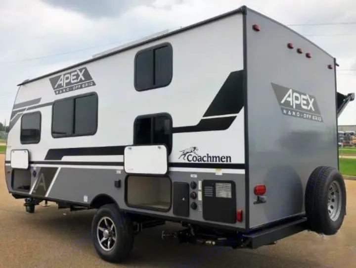 Side view of a gray/white Coachmen Apex Nano off-grid travel trailer. Perfect for your next RV rental or camping adventure.. Coachmen Apex 2024