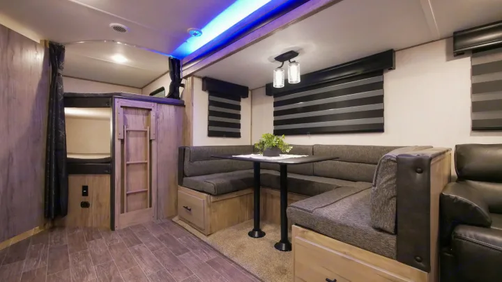 Spacious RV rental with a U-shaped dinette, bunk beds, and recliner for ultimate comfort.. Forest River Cherokee Alpha Wolf 2021