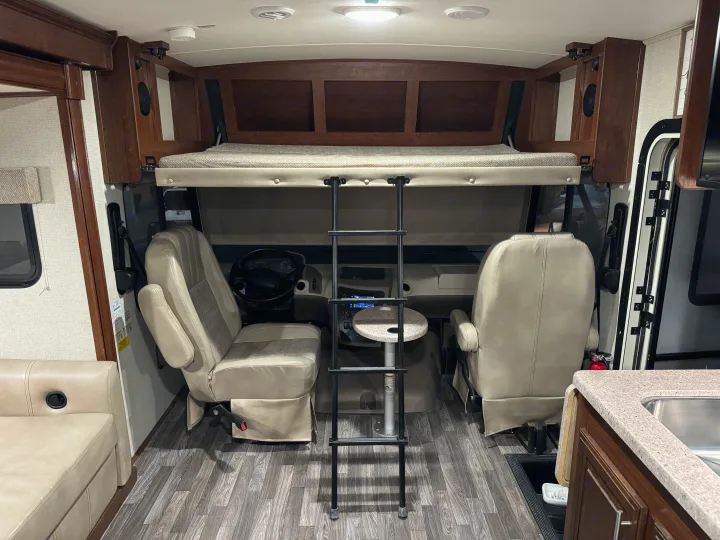 RV rental: Interior view showing the front cab with swivel seats, overhead bed, and living space.. FR3 FR3 Motorhome 2018
