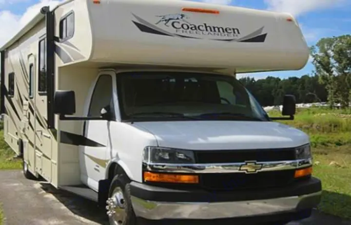 White Coachmen Freelander Class C rv rental parked outdoors, ready for your next adventure.. Coachmen Freelander 2018