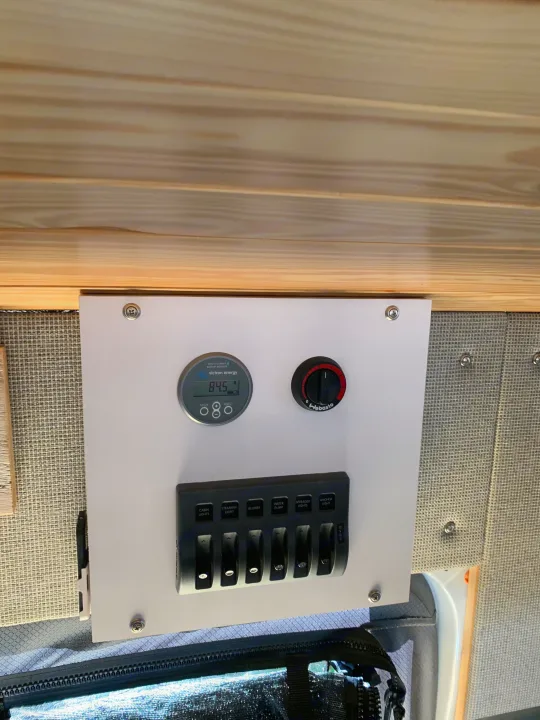 RV rental control panel: Victron battery monitor (84.5%), Webasto heater, and switches for lights, water pump, blower.. Ford Custom Transit 2019