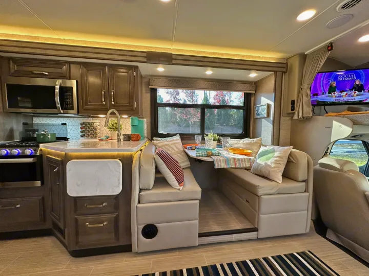 Experience this RV rental's well-appointed kitchen, dinette, and living space, ideal for motorhome adventures.. Entegra Coach Esteem 2023