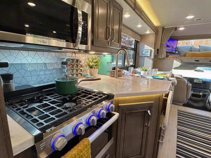 This RV rental boasts a full kitchen with a gas stove & microwave, plus a comfortable bunk and living space.. Entegra Coach Esteem 2023