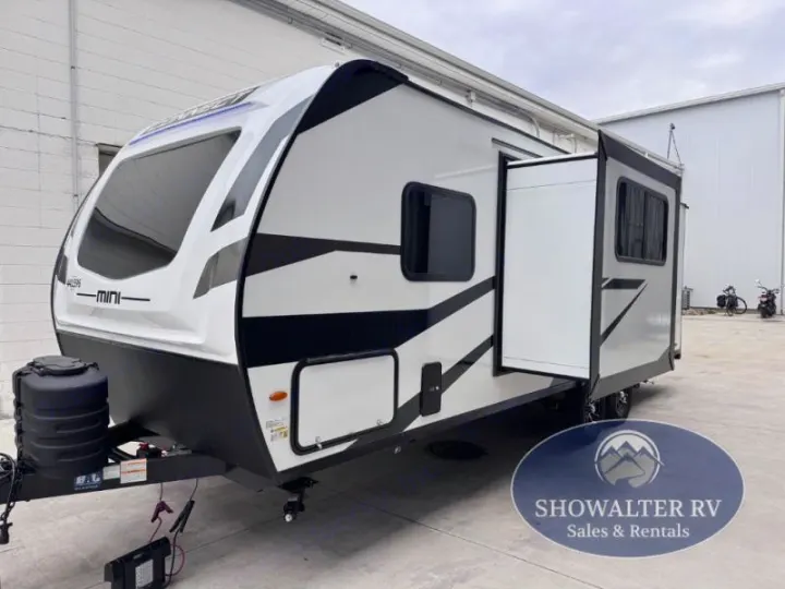 White & black "Mini" travel trailer with a slide-out, perfect for your next RV rental adventure.. K-Z Manufacturing Connect Mini 231BH 2025