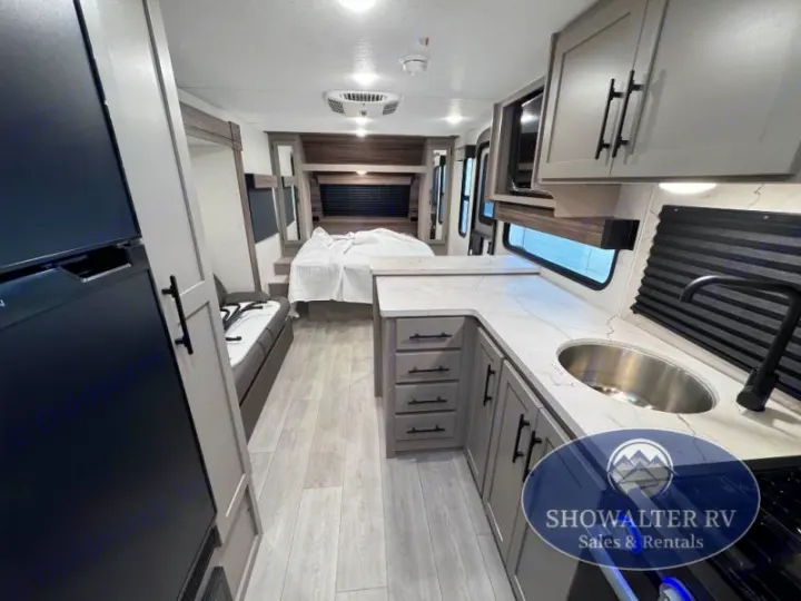 Step inside this spacious RV rental! Features a modern kitchen with a sink, refrigerator, comfortable bedroom, and living area.. K-Z Manufacturing Connect Mini 231BH 2025