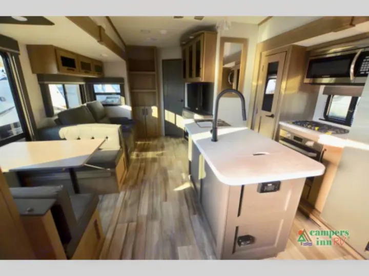 Explore this bright rv rental! Features a modern kitchen island, spacious dinette, and comfortable sofa in the living area.. Grand Design Reflection 2023