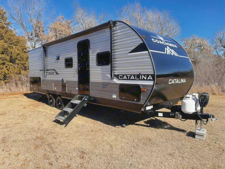 Modern Coachmen Catalina travel trailer, ideal for an RV rental, parked outdoors on a sunny day.. Coachmen Catalina Summit Series 8 261BHS 2025