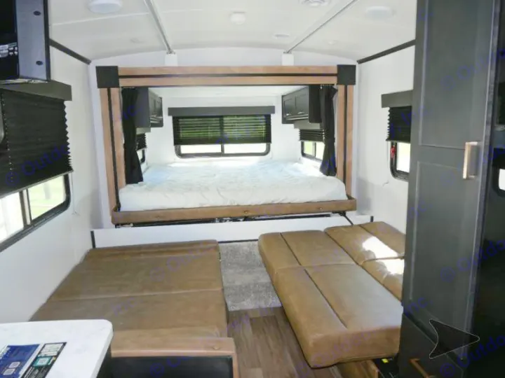 This RV rental's versatile interior features a queen bed in the rear and two sofa sections below.. Keystone RV Outback Ultra-Lite 2022