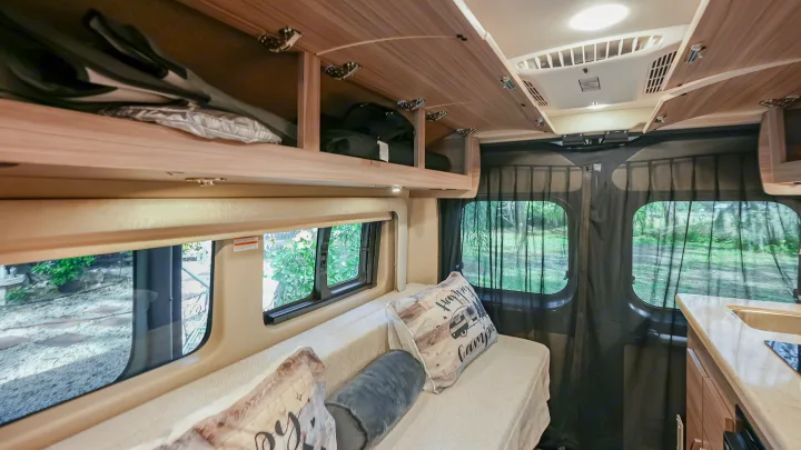 Experience adventure in this RV rental! Interior shows a comfortable seating/sleeping area, storage, and kitchenette.. Jayco swift 2024