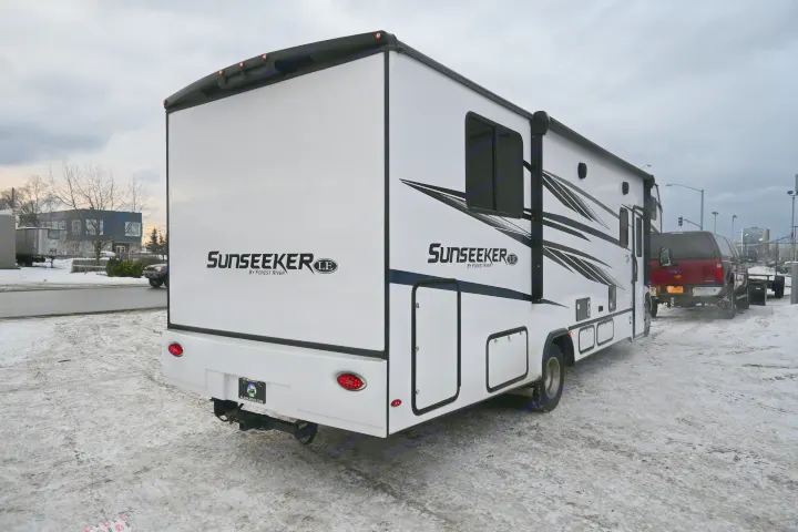 Explore Alaska with this Sunseeker RV rental, visible on a snowy lot under an overcast sky.. Forest River Sunseeker - LE Series M-2850S 2024