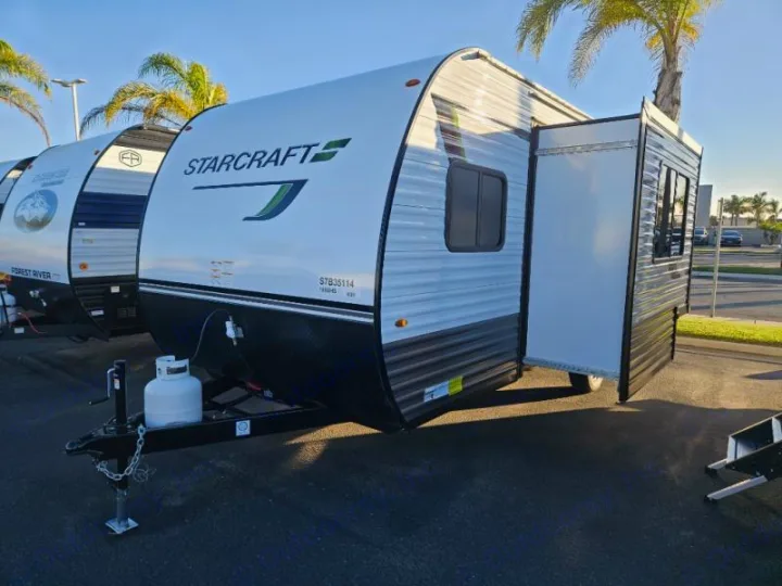This bright white Starcraft travel trailer, featuring an open slide-out section, makes a perfect RV rental for your adventures.. StarCraft 188BHS 2025