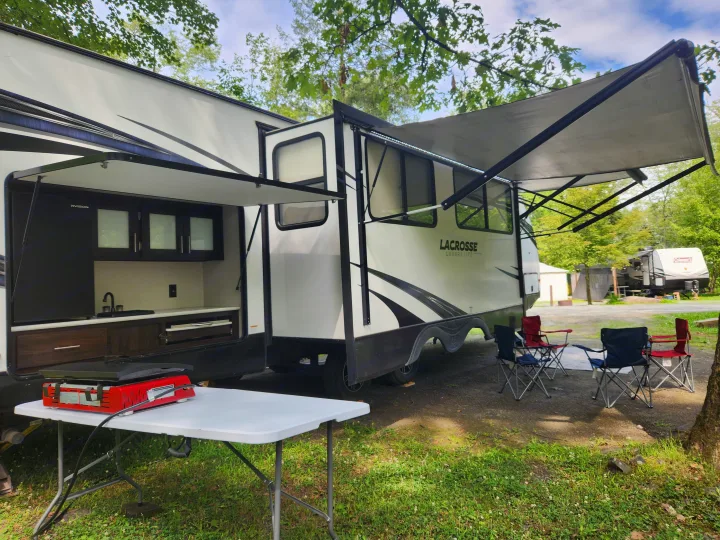 This RV rental offers an open outdoor kitchen, illuminated awning, and camping chairs for ultimate campsite comfort.. Prime Time Lacrosse 2019