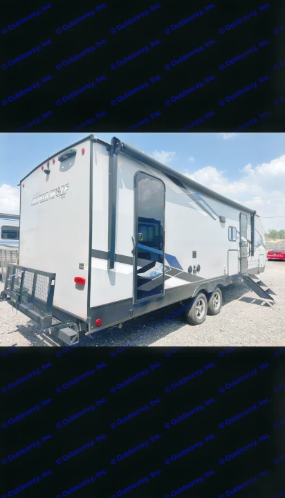 This gray Alpha Wolf toy hauler RV rental features a rear cargo rack and multiple doors, perfect for your next journey.. Forest River Cherokee Alpha Wolf 2023