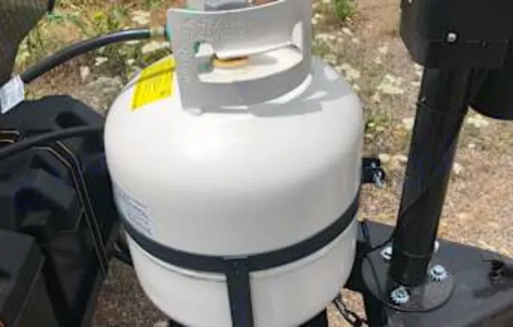 RV rental's white propane tank, essential for camping travel. Powers your adventures.. Coachmen Clipper 2022